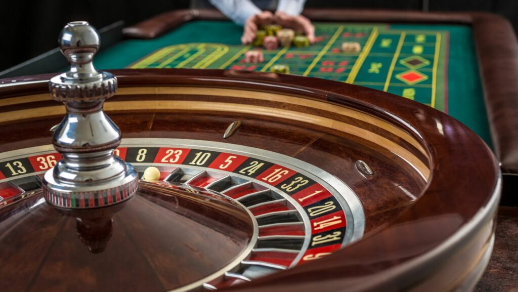 Player browsing the ICE Casino website on a laptop, with bright blue interface, slot games, and bonus banners visible on screen, representing secure online gambling and promotions.